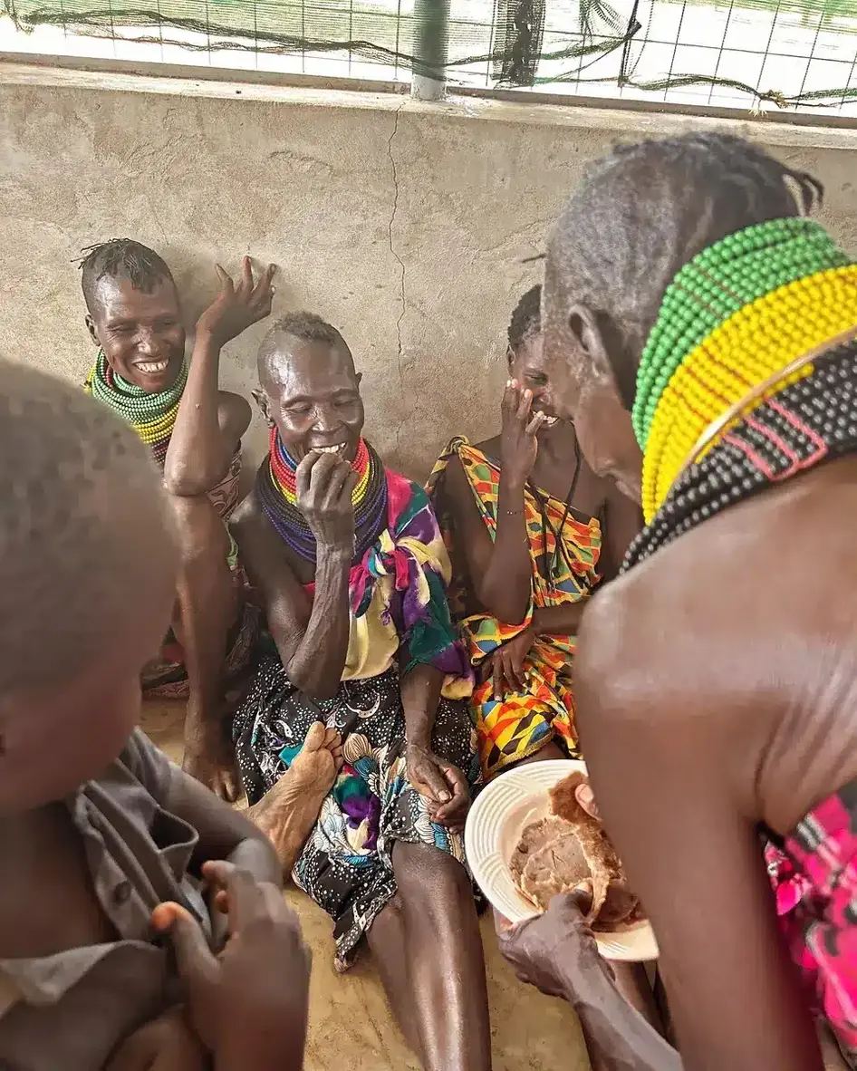Women in Turkana, Kenya sharing a meal together
